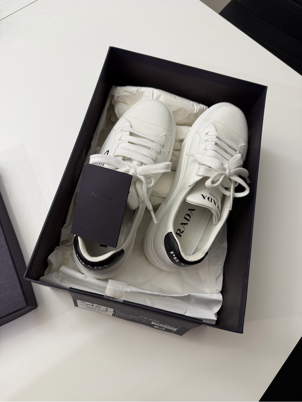 Prada White Leather Low-Top Sneakers with Black Heel Patch - Picture 4 of 4